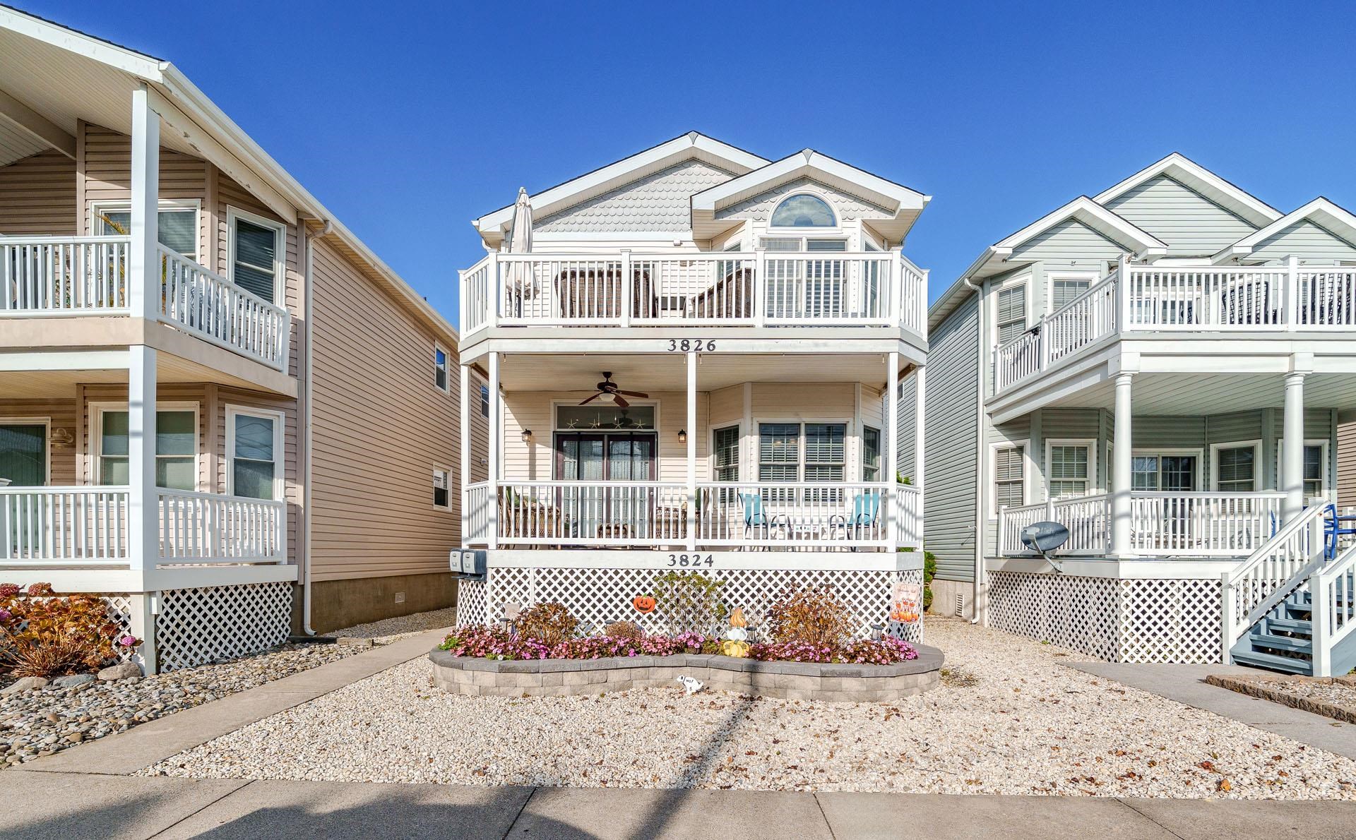 3824 Asbury Avenue, Unit 1 Ocean City, NJ 08226 - Photo 36 of 40 a front view of a house with a yard