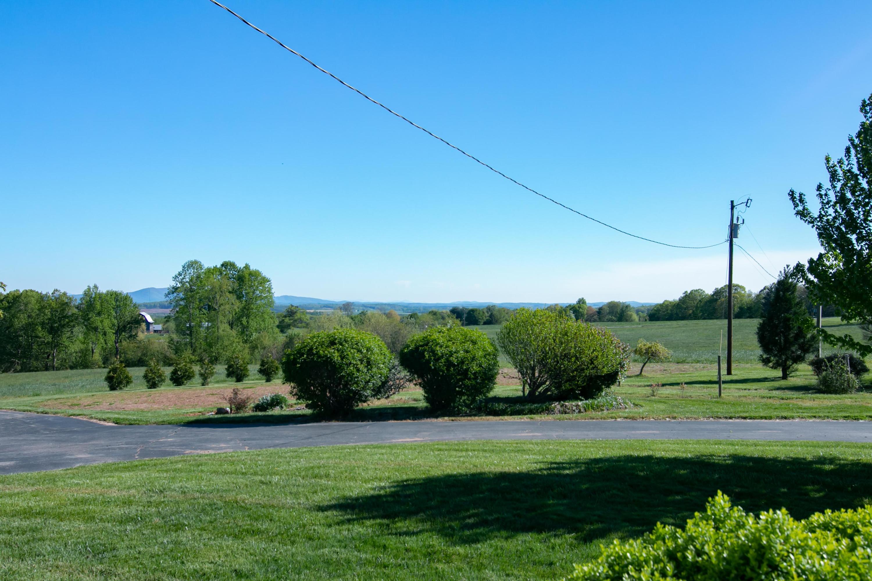 3257 Sago Road Chatham, VA 24531 - Photo 11 of 94 a view of a garden with a building in the background