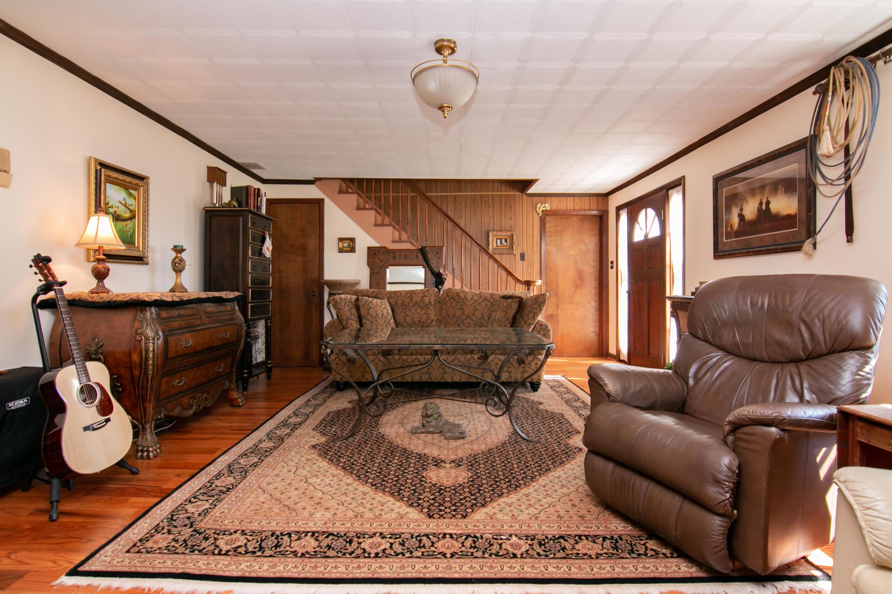 3257 Sago Road Chatham, VA 24531 - Photo 22 of 94 a living room with furniture a rug and a window