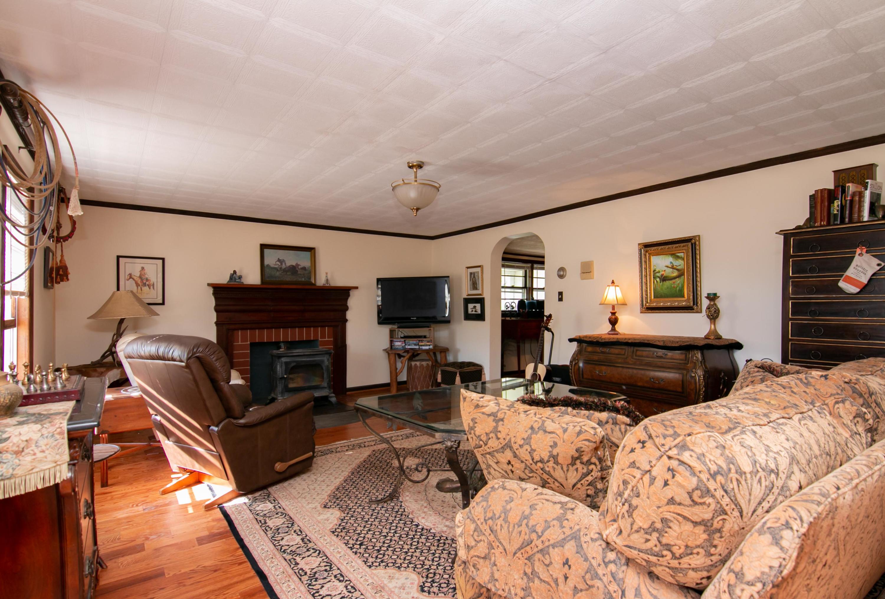 3257 Sago Road Chatham, VA 24531 - Photo 40 of 94 a living room with furniture a fireplace and a flat screen tv