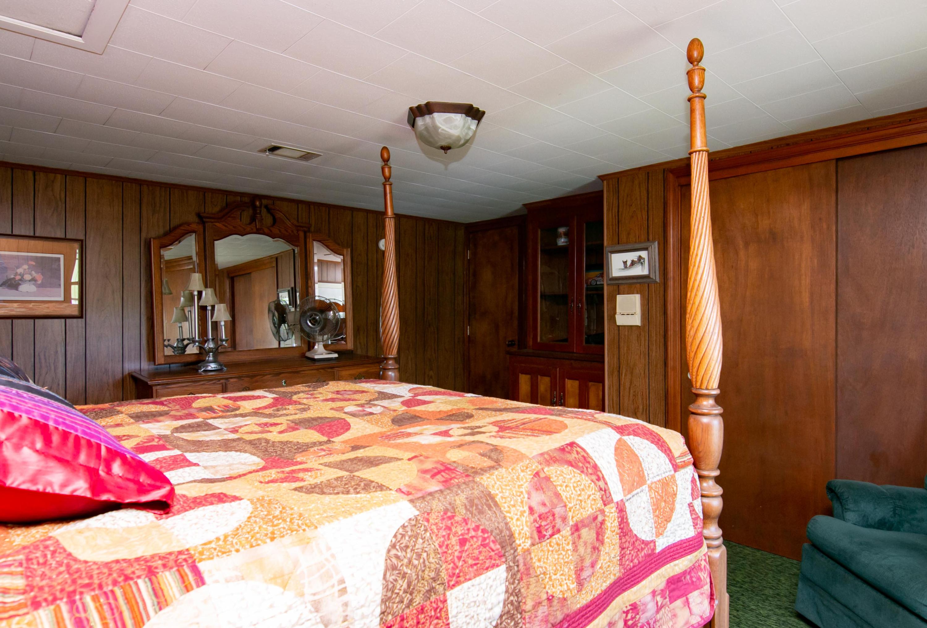 3257 Sago Road Chatham, VA 24531 - Photo 56 of 94 a bedroom with a bed dresser and a large mirror