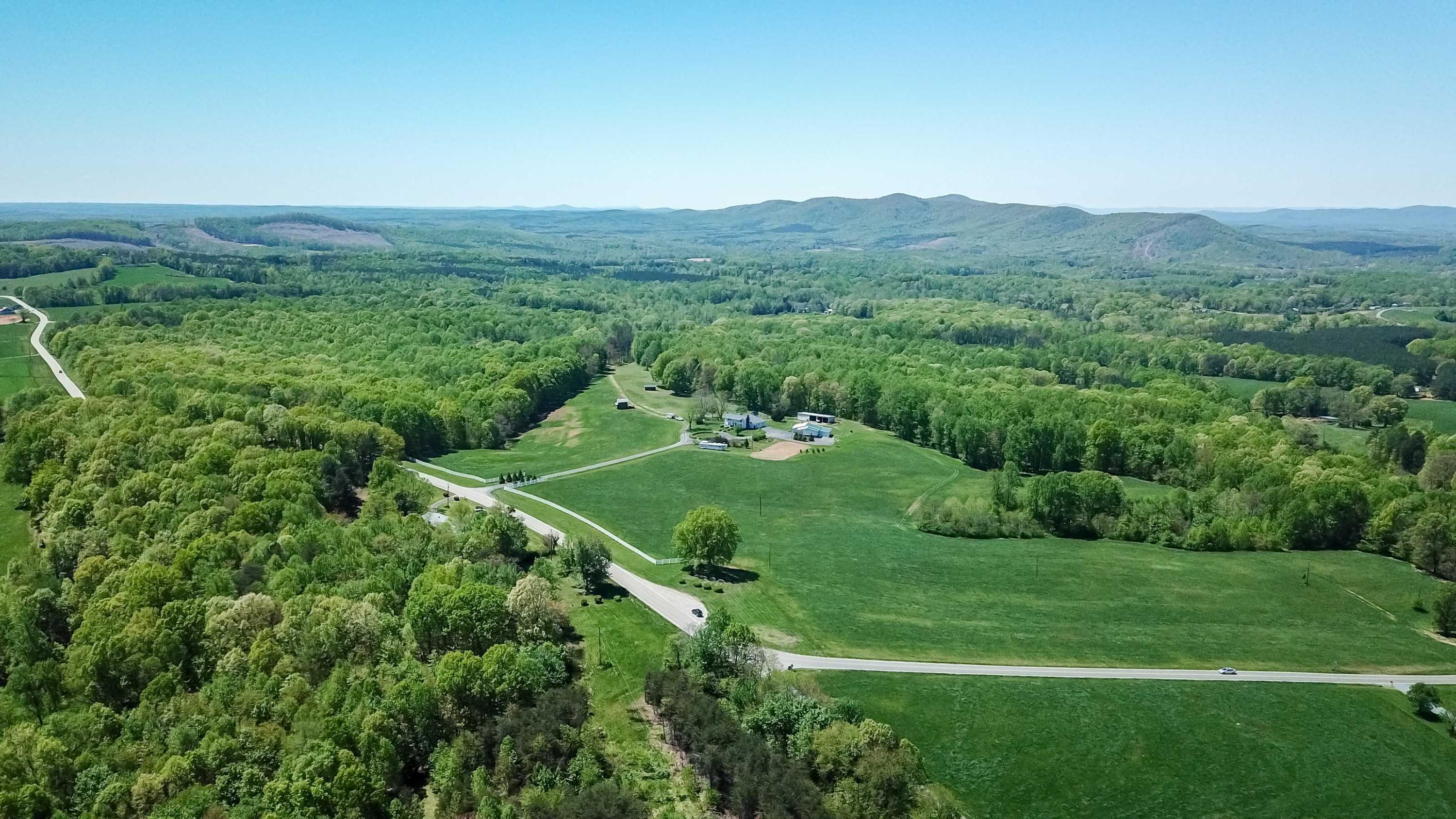 3257 Sago Road Chatham, VA 24531 - Photo 65 of 94 a view of a lush green field with mountains in the background