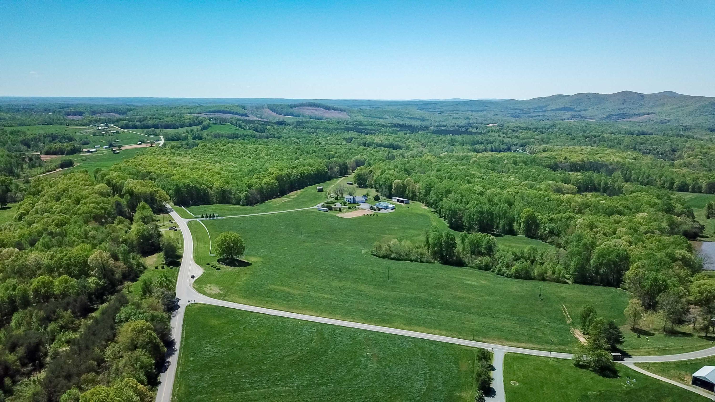 3257 Sago Road Chatham, VA 24531 - Photo 66 of 94 a view of a lush green outdoor space with a lake view