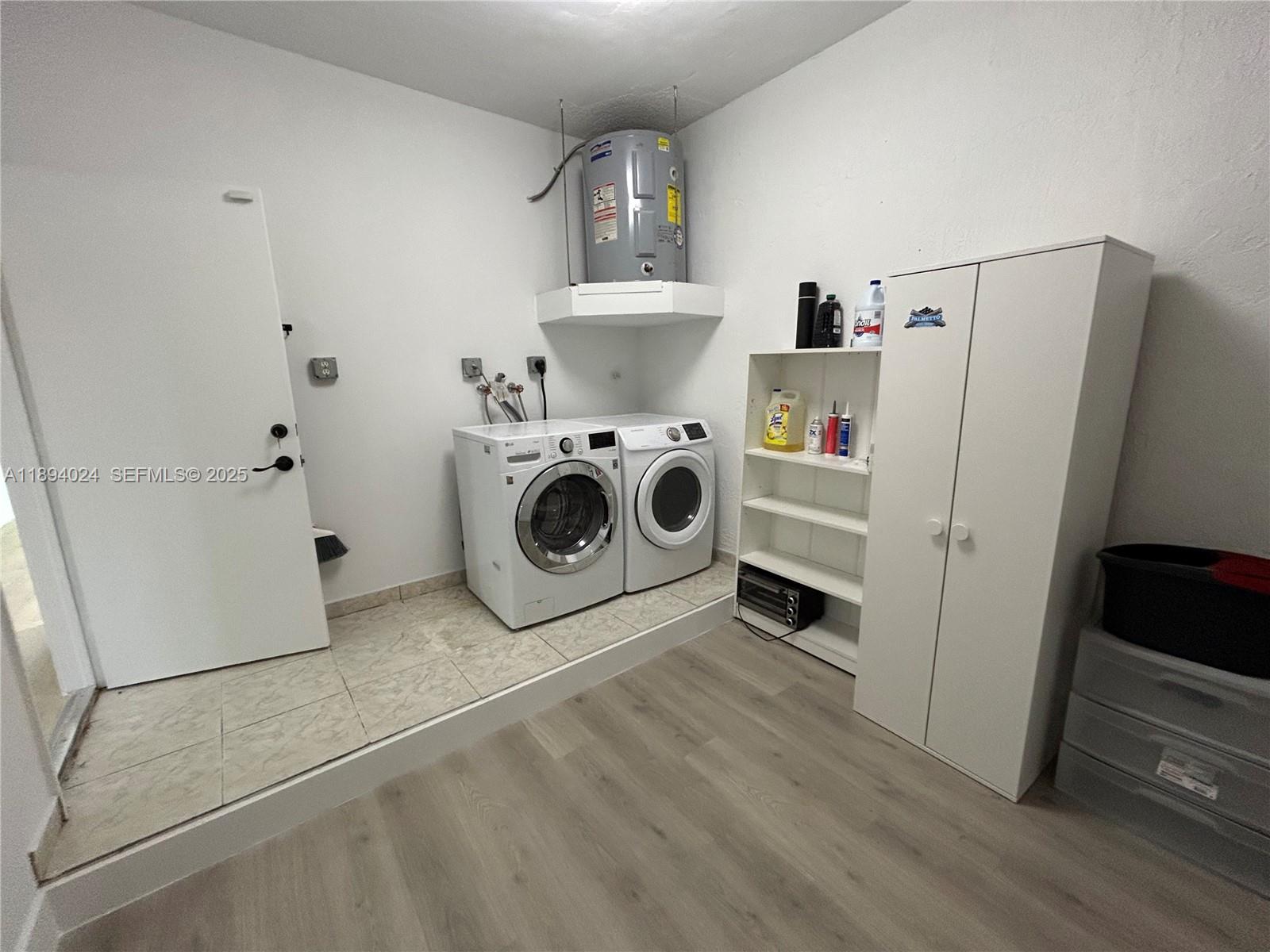 8725 Southwest 158th Place Miami, FL 33193 - Photo 21 of 53 a utility room with dryer and washer