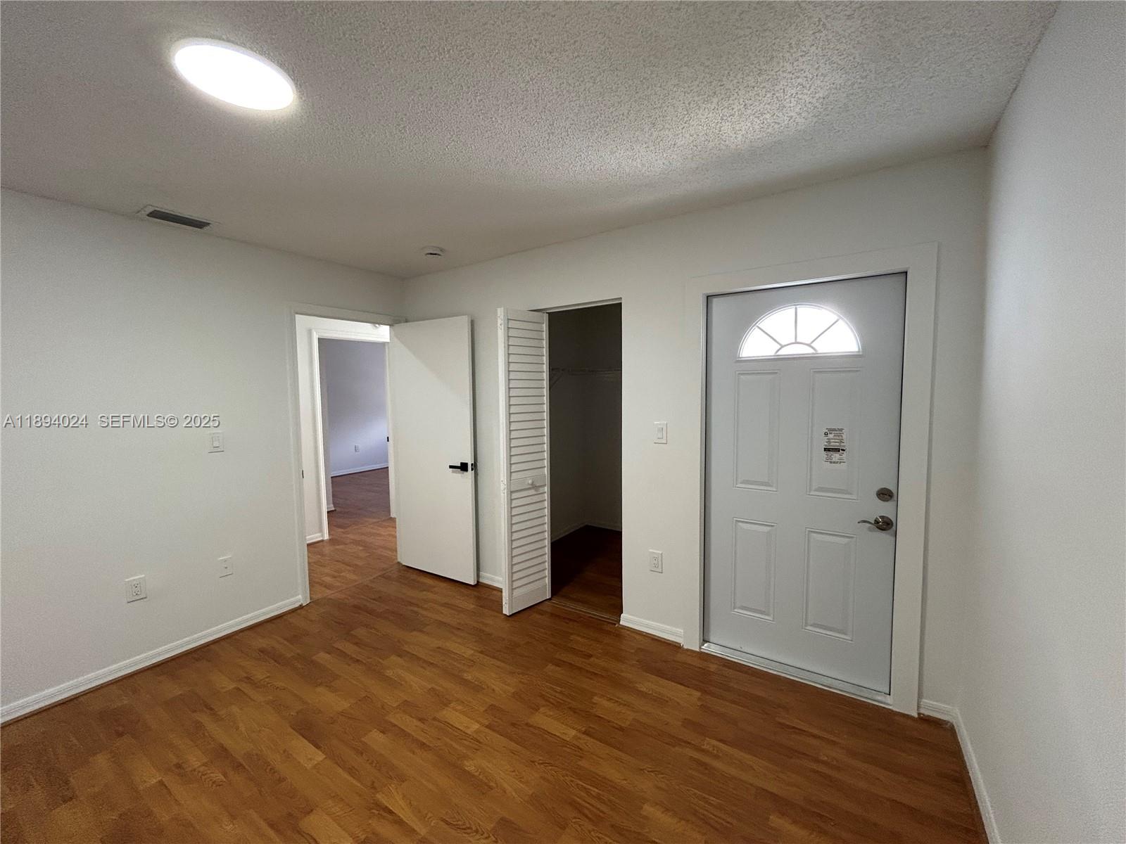 8725 Southwest 158th Place Miami, FL 33193 - Photo 28 of 53 wooden floor in an empty room