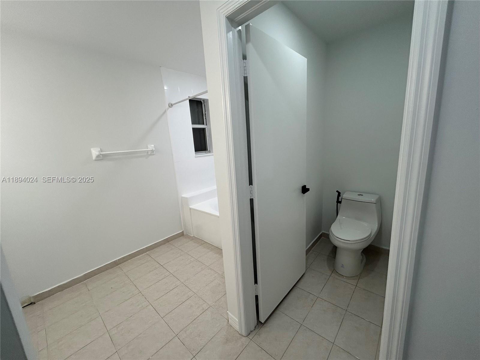 8725 Southwest 158th Place Miami, FL 33193 - Photo 41 of 53 wooden view of bathroom with a toilet