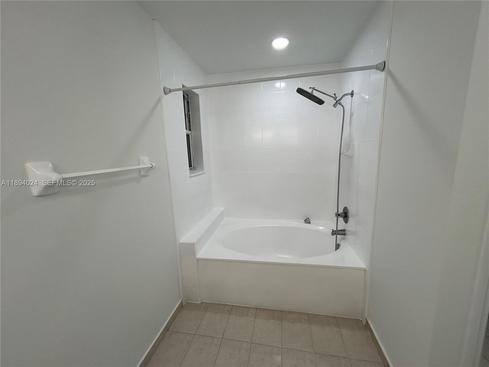 8725 Southwest 158th Place Miami, FL 33193 - Photo 42 of 53 a bathroom with a bathtub and a shower