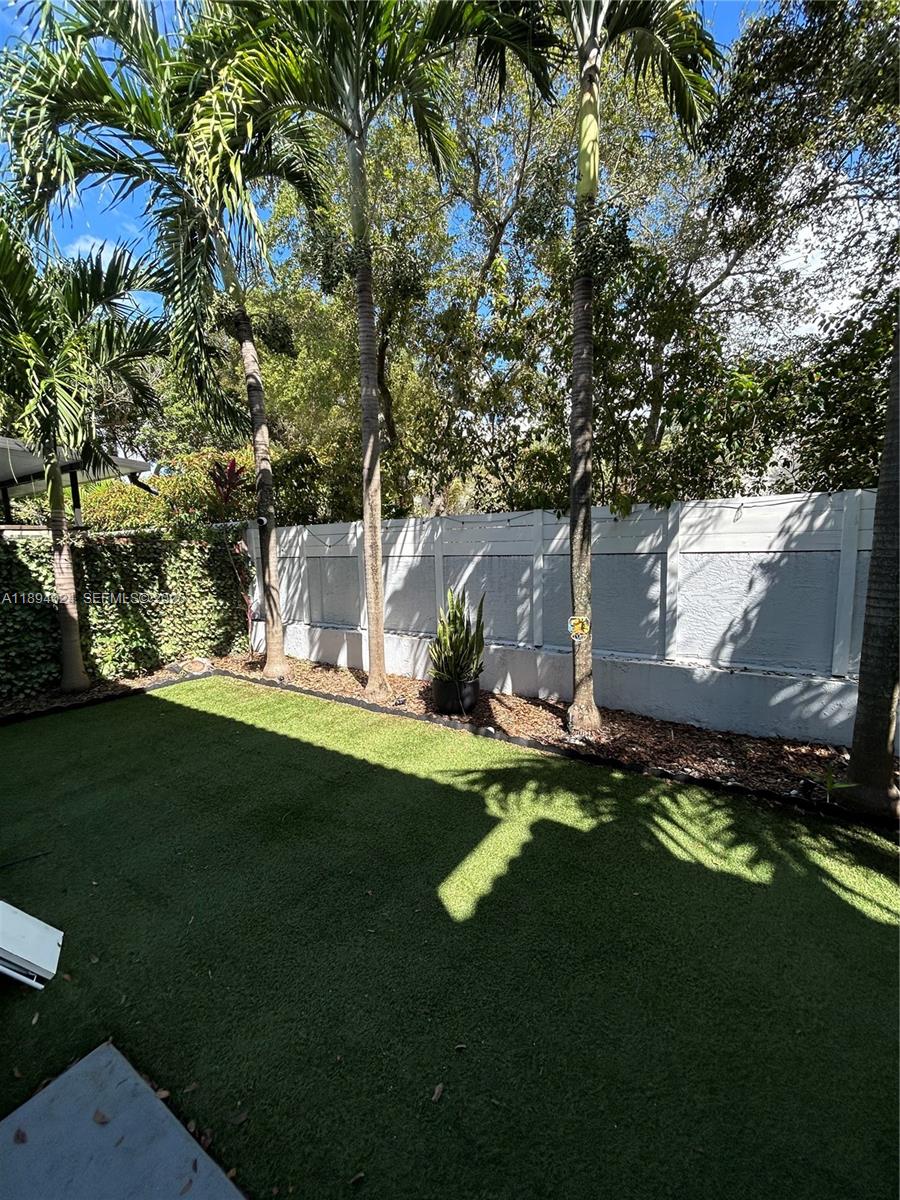 8725 Southwest 158th Place Miami, FL 33193 - Photo 47 of 53 a view of a house with a garden