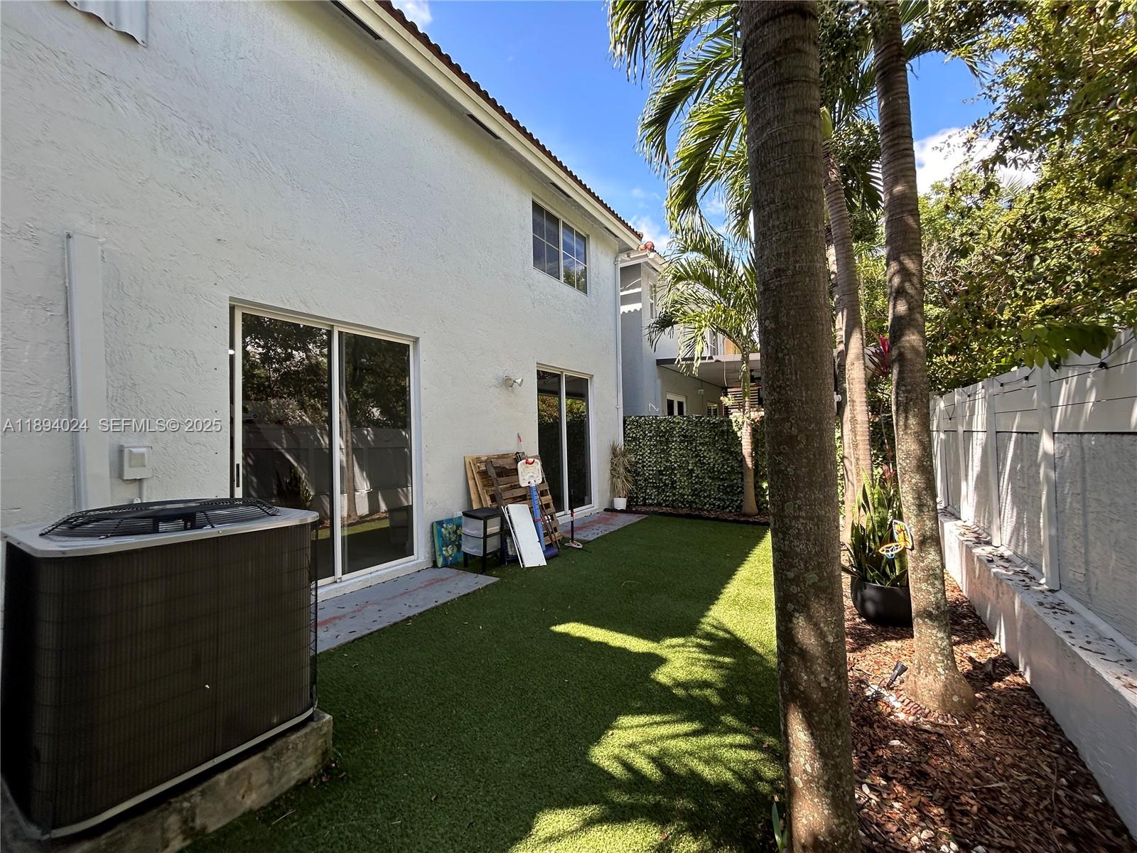 8725 Southwest 158th Place Miami, FL 33193 - Photo 50 of 53 a view of a house with backyard