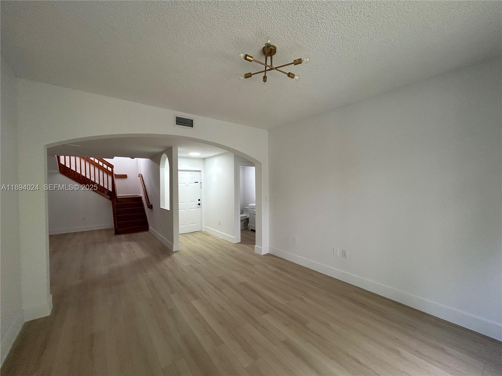 8725 Southwest 158th Place Miami, FL 33193 - Photo 8 of 53 wooden floor in an empty room