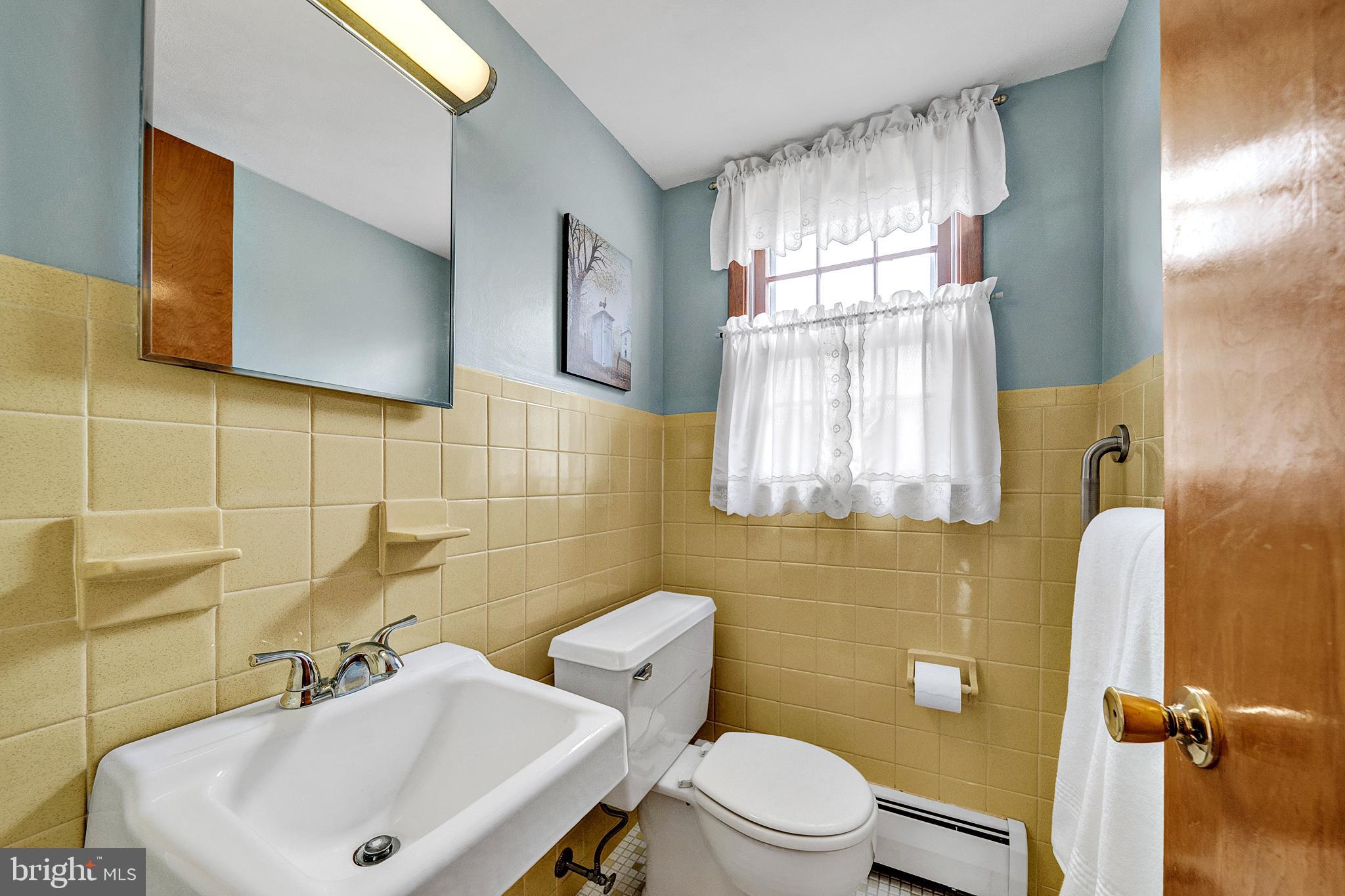 21 Fabrow Drive Titusville, NJ 08560 - Photo 21 of 43 a bathroom with a sink a mirror and a toilet