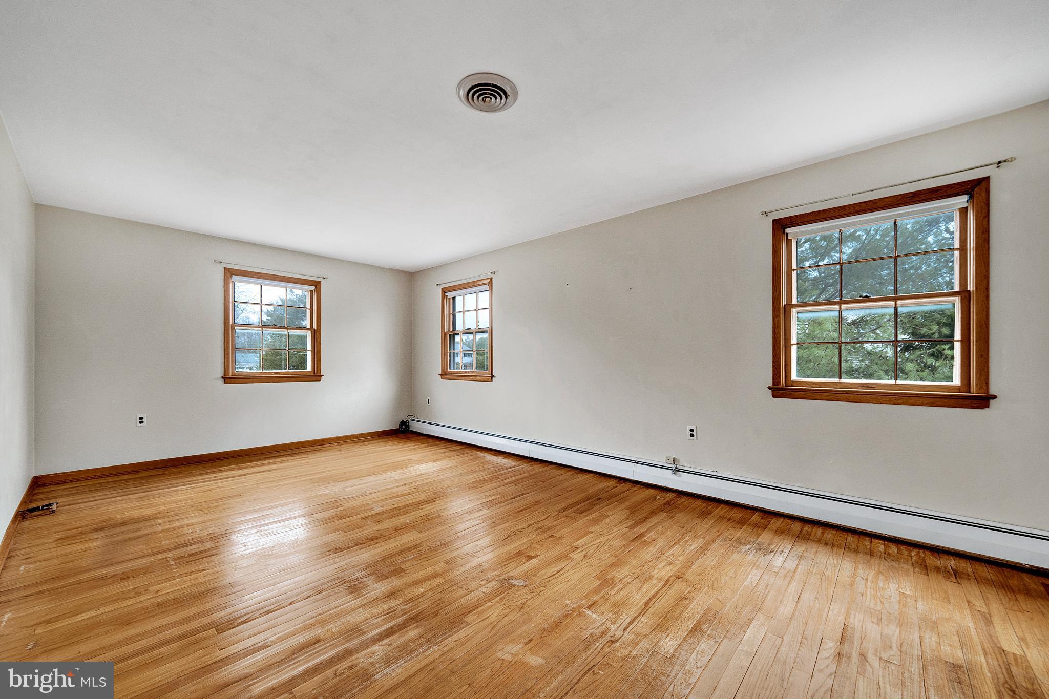 21 Fabrow Drive Titusville, NJ 08560 - Photo 22 of 43 a view of an empty room with window and wooden floor