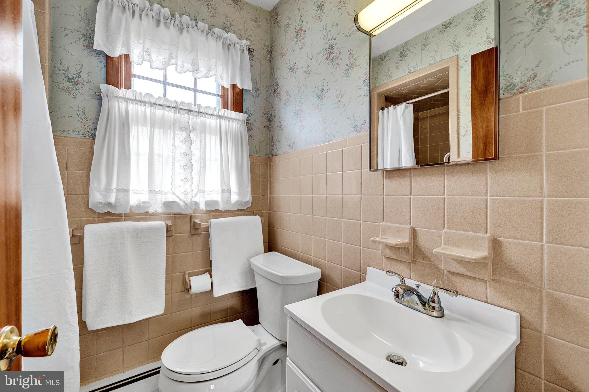 21 Fabrow Drive Titusville, NJ 08560 - Photo 25 of 43 a bathroom with a sink a mirror and a toilet