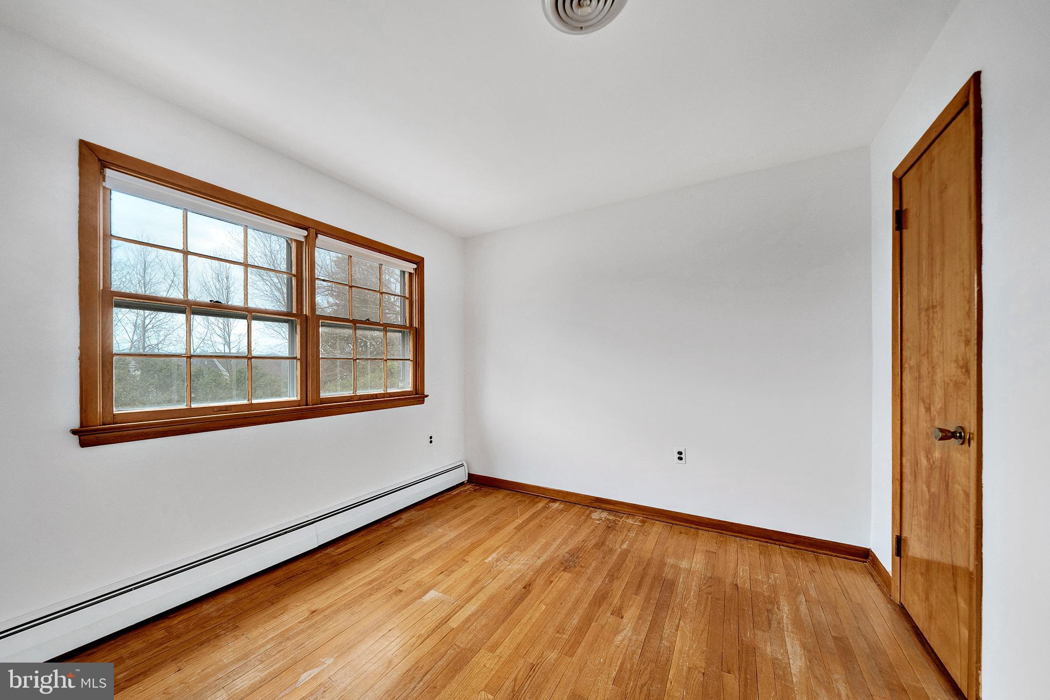 21 Fabrow Drive Titusville, NJ 08560 - Photo 26 of 43 wooden floor in an empty room with a window