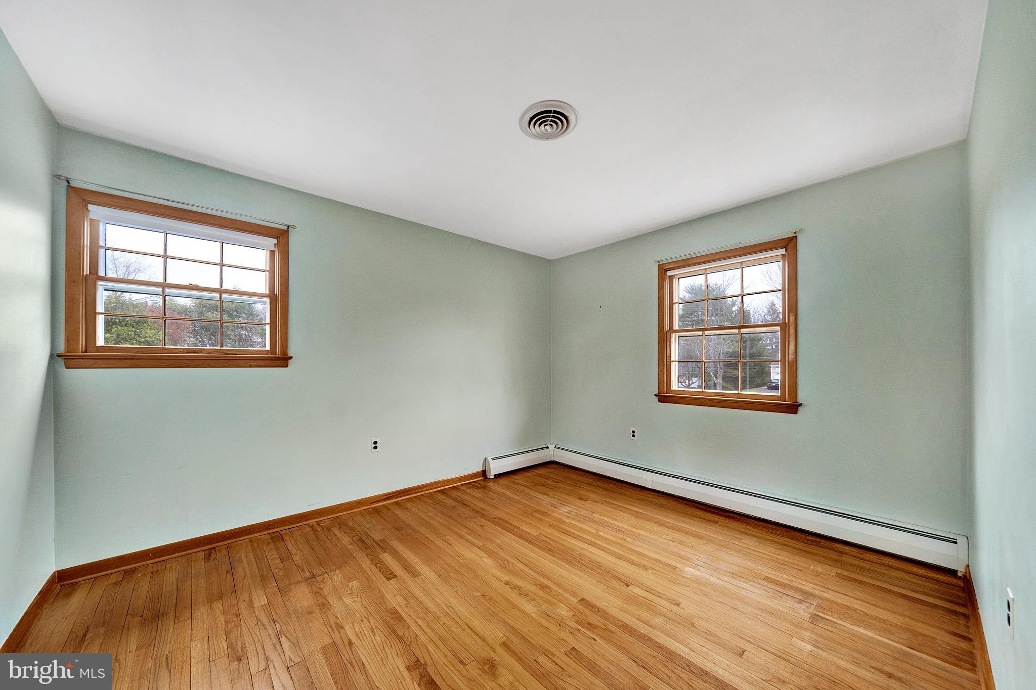 21 Fabrow Drive Titusville, NJ 08560 - Photo 27 of 43 a view of empty room with window and wooden floor