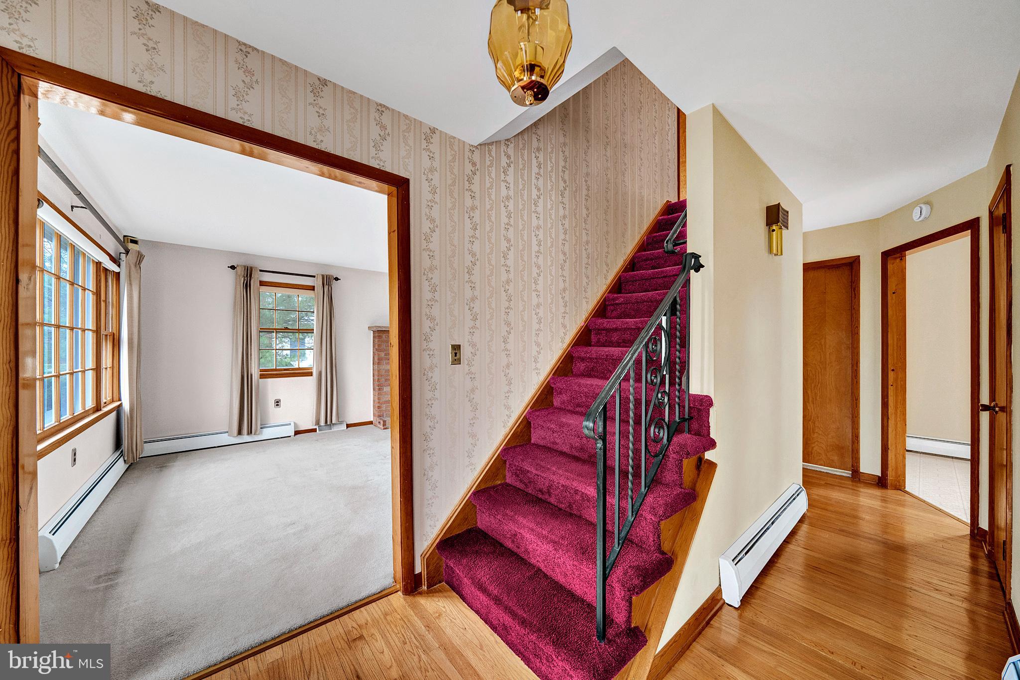 21 Fabrow Drive Titusville, NJ 08560 - Photo 6 of 43 a view of a hallway with wooden floor and stairs