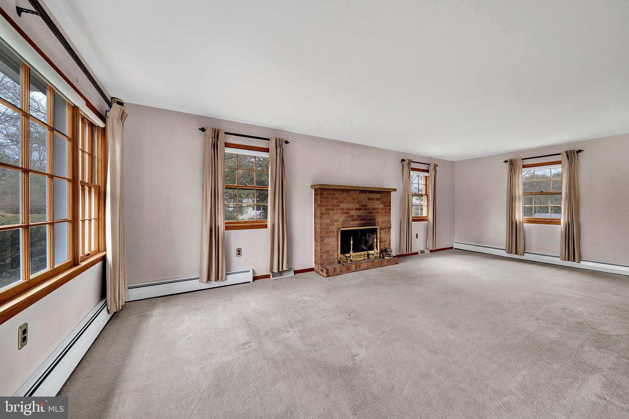 21 Fabrow Drive Titusville, NJ 08560 - Photo 8 of 43 an empty room with furniture and a fireplace