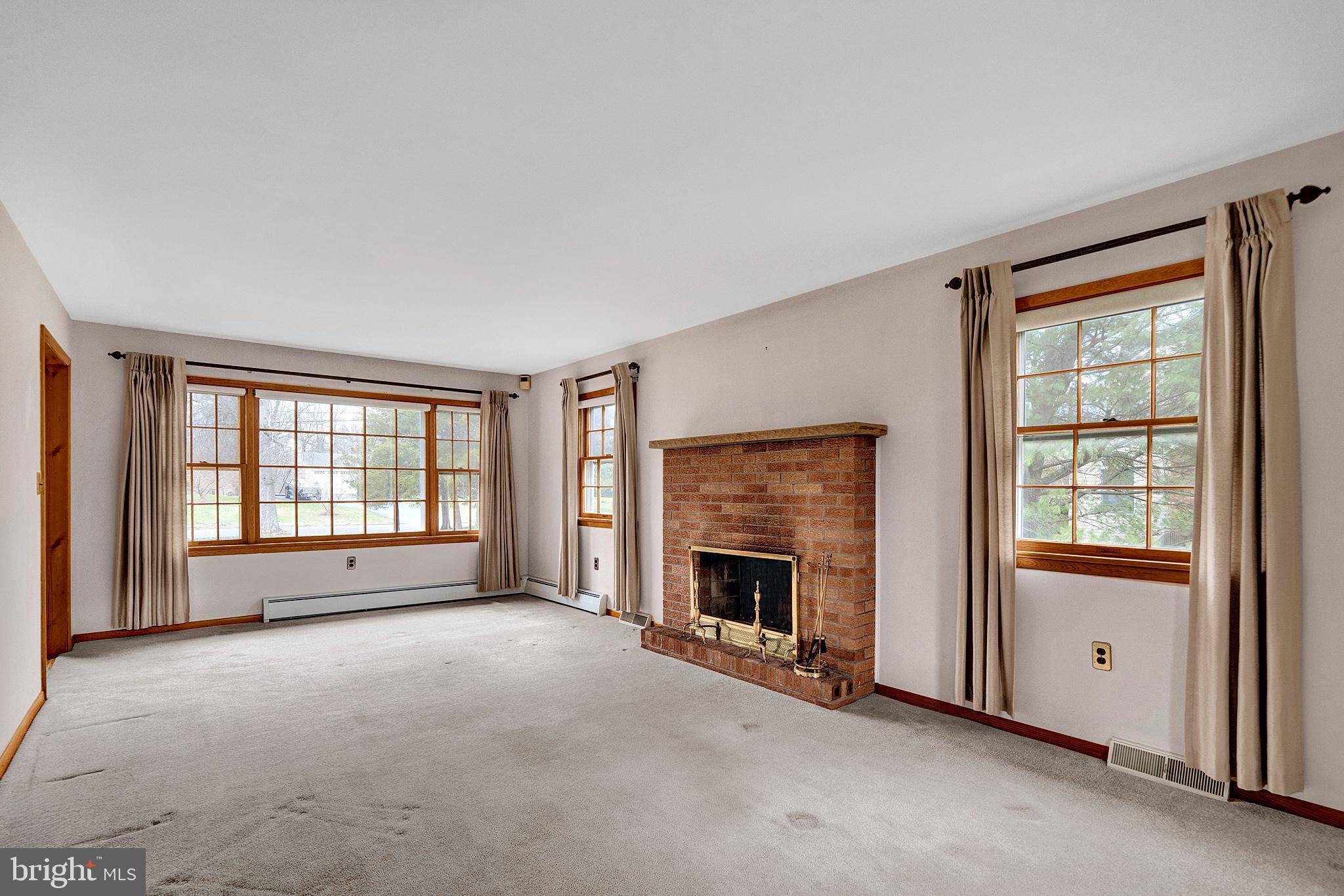 21 Fabrow Drive Titusville, NJ 08560 - Photo 10 of 43 an empty room with windows and fireplace