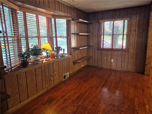 a kitchen with sink cabinets and wooden floor