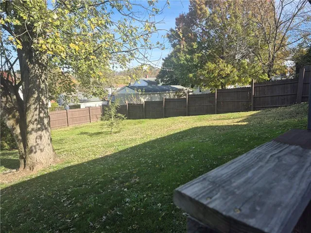 a view of a backyard with a small cabin