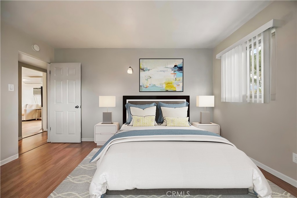 680 North 10th Street Banning, CA 92220 - Photo 12 of 24 a bedroom with a bed and painting on the wall