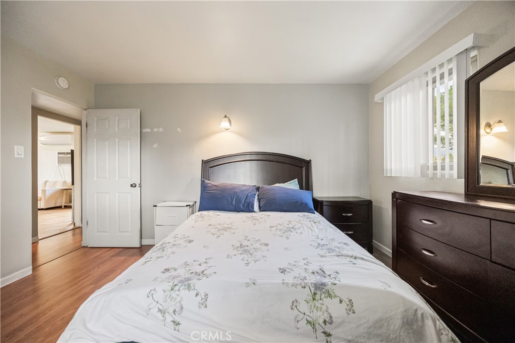 680 North 10th Street Banning, CA 92220 - Photo 13 of 24 a bedroom with a bed and a dresser