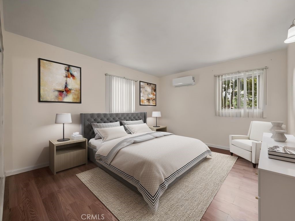 680 North 10th Street Banning, CA 92220 - Photo 14 of 24 a bedroom with a bed and a couch