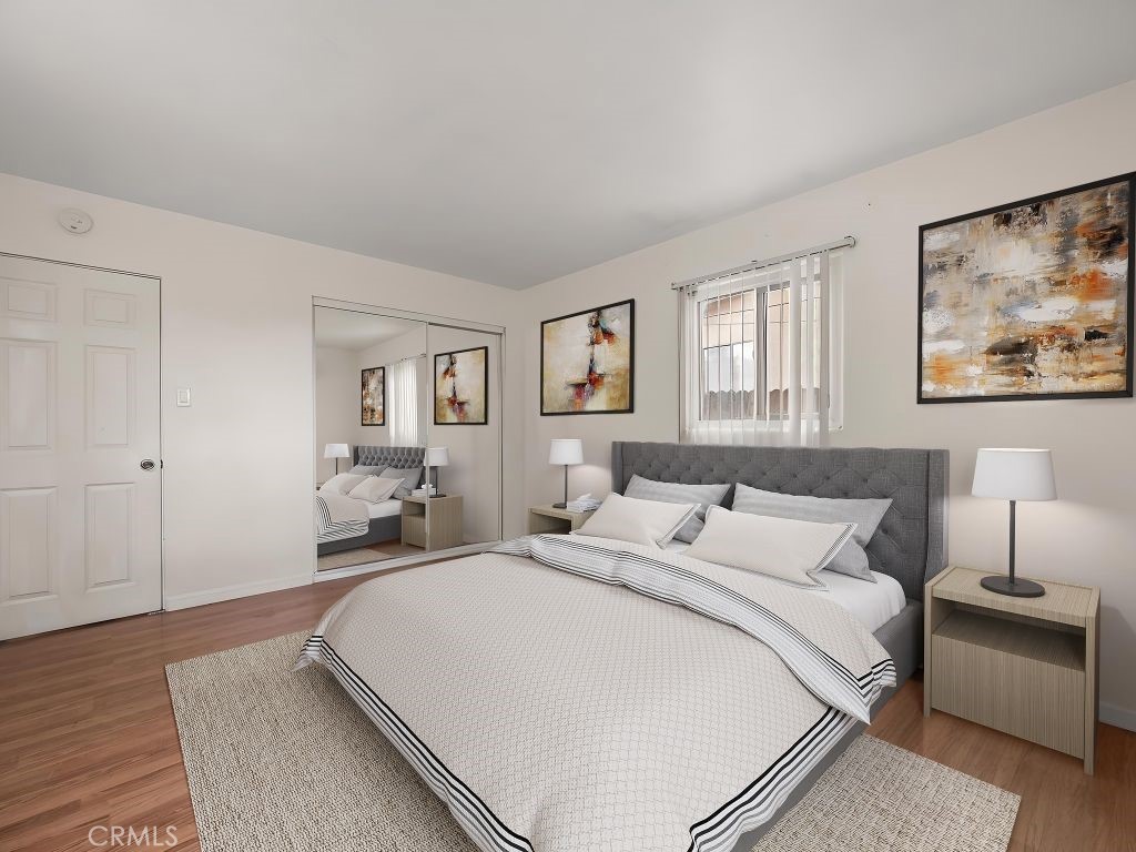 680 North 10th Street Banning, CA 92220 - Photo 16 of 24 a bedroom with a bed and a painting on the wall