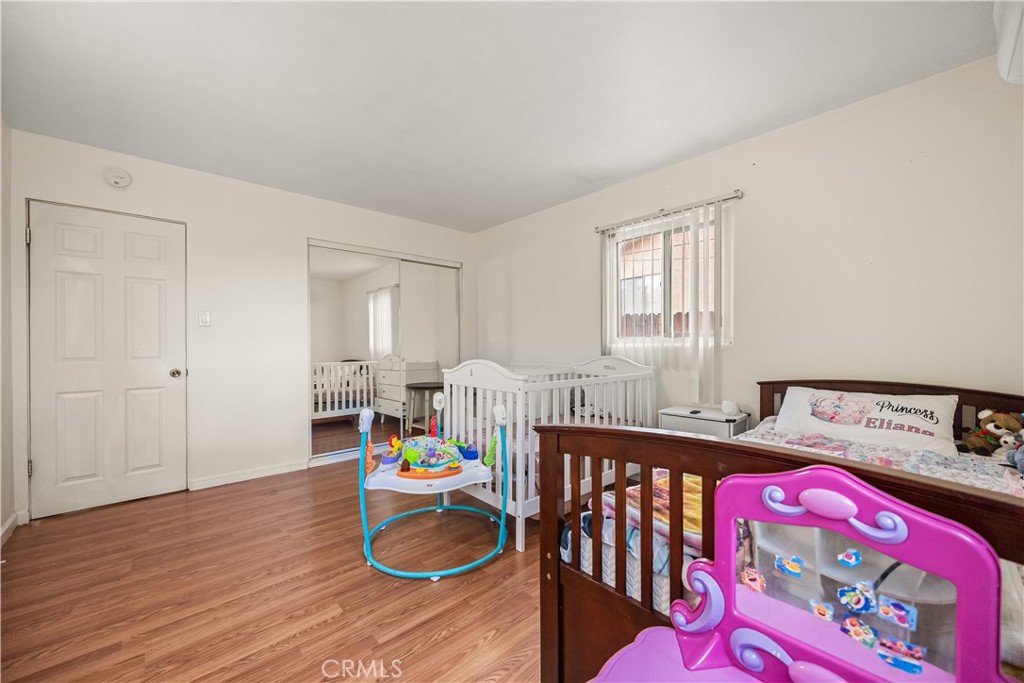 680 North 10th Street Banning, CA 92220 - Photo 17 of 24 a bedroom with furniture and a window