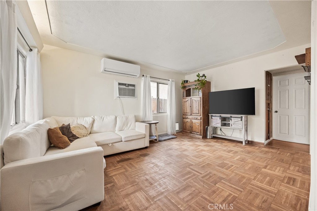 680 North 10th Street Banning, CA 92220 - Photo 3 of 24 a living room with furniture and a flat screen tv