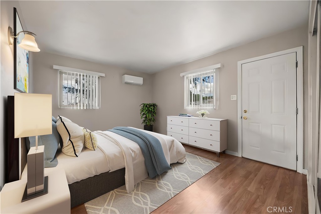 680 North 10th Street Banning, CA 92220 - Photo 8 of 24 a bedroom with a bed and a window