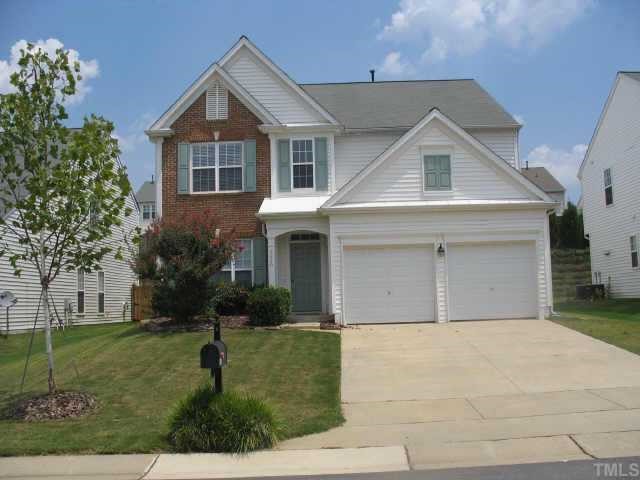 7420 Silver View Lane Raleigh, NC 27613 - Photo 1 of 10 a front view of a house with a yard and garage