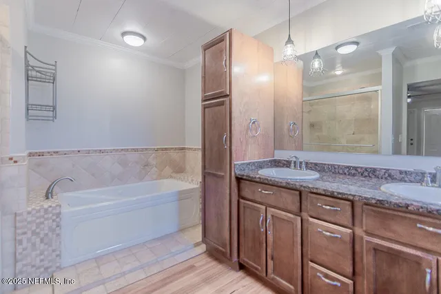 a bathroom with a bathtub and a shower