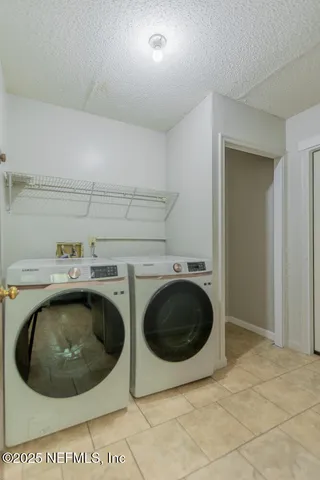 a view of a backyard with a garden and tree