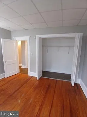 a view of an empty room and wooden floor