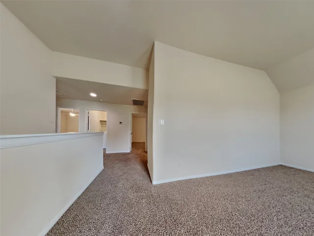a view of a big room with closet and windows
