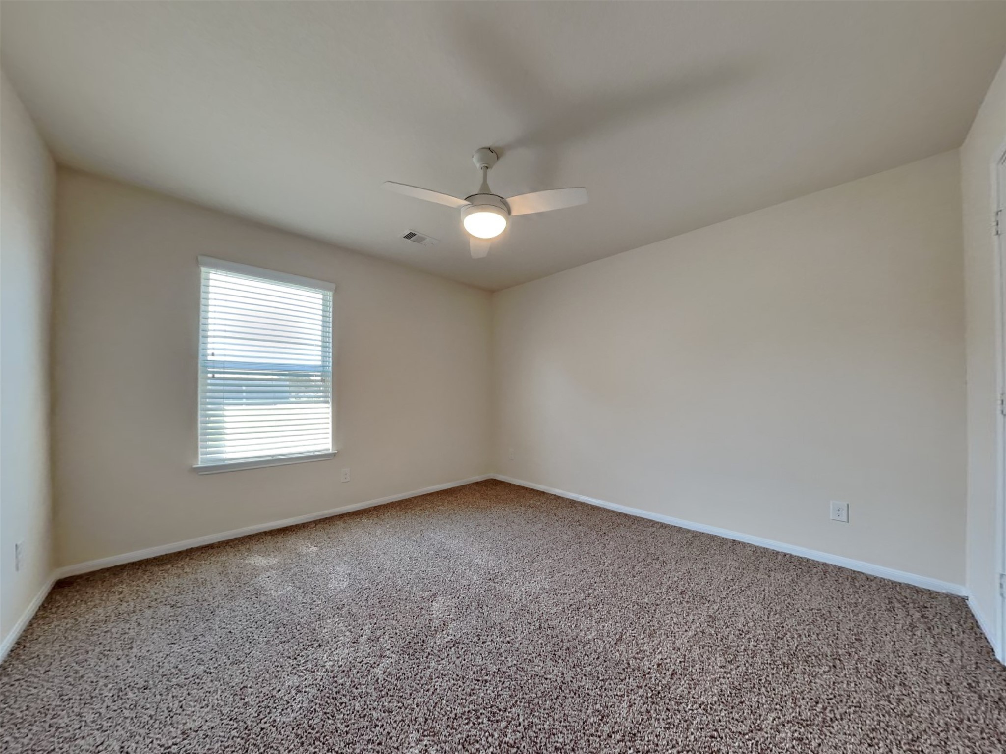 15315 Signal Ridge Way Cypress, TX 77429 - Photo 19 of 23 an empty room with a window and a ceiling fan