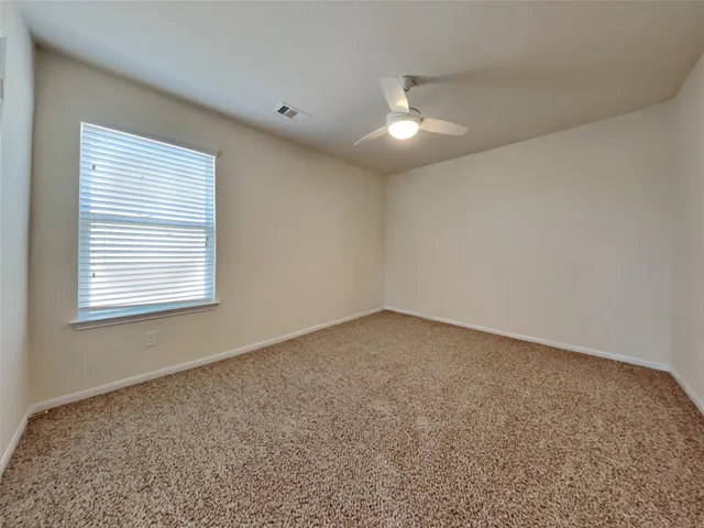 an empty room with a empty space and a window