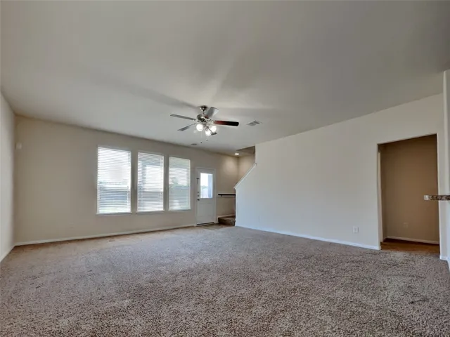 a view of empty room with windows