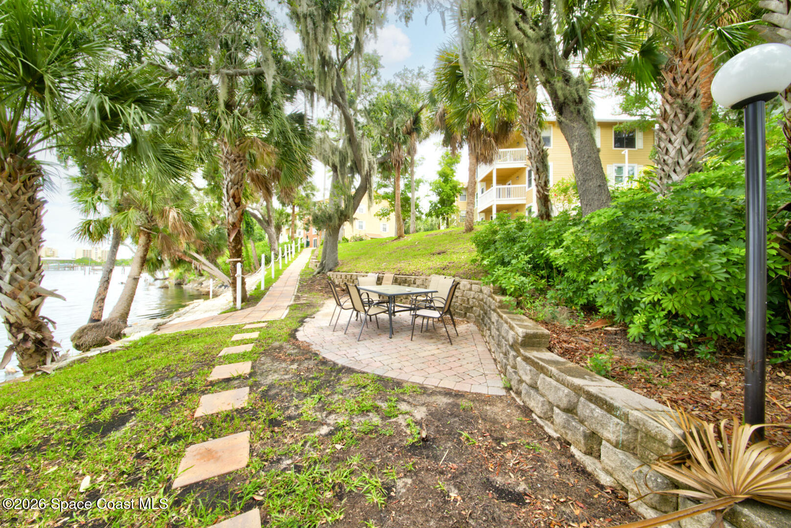 225 South Tropical Trail, Unit 605 Merritt Island, FL 32952 - Photo 24 of 36 Sunset Bay walkway by river