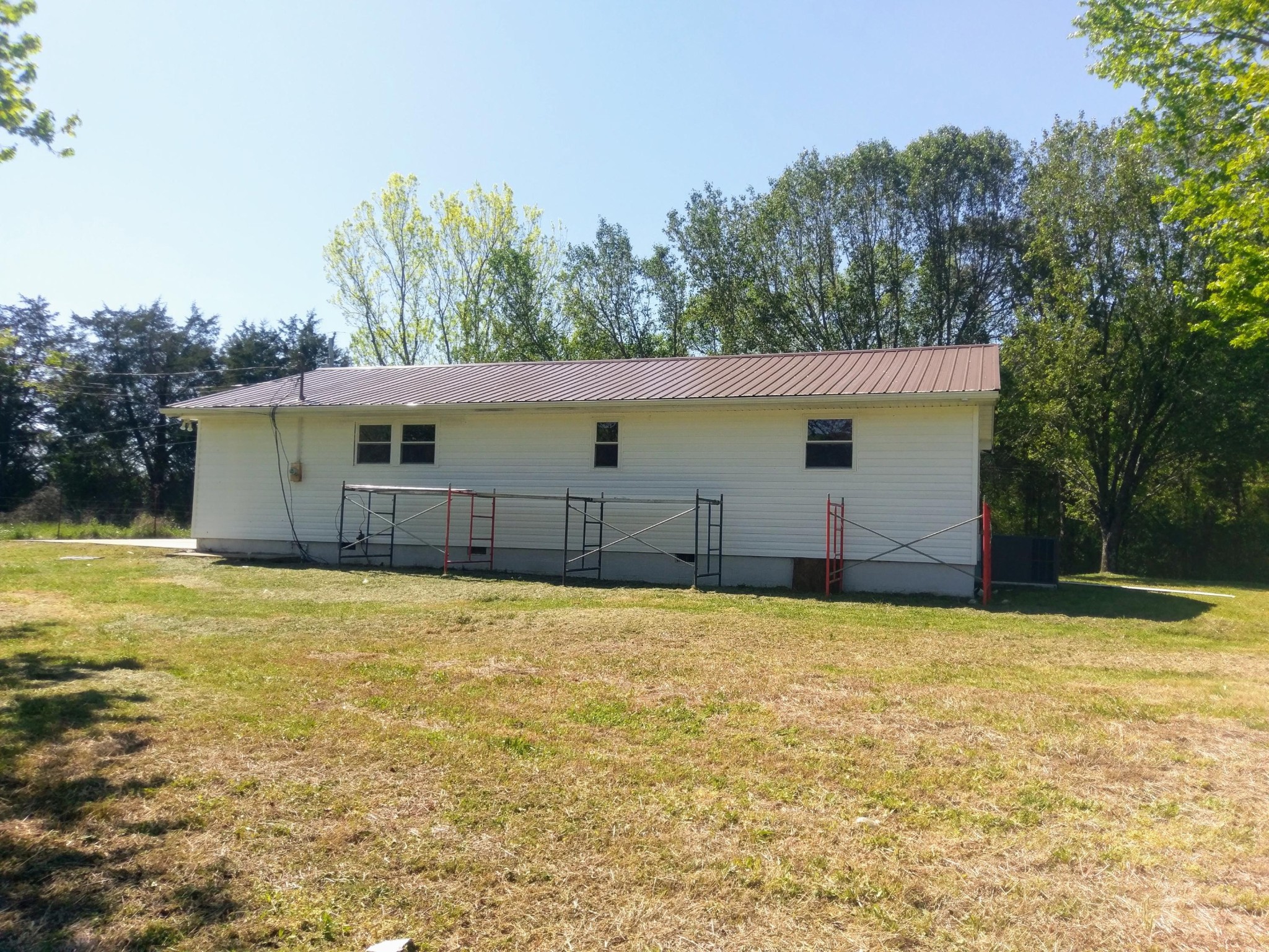 304 Cade Road Ten Mile, TN 37880 - Photo 13 of 19 a view of a house with backyard and trees