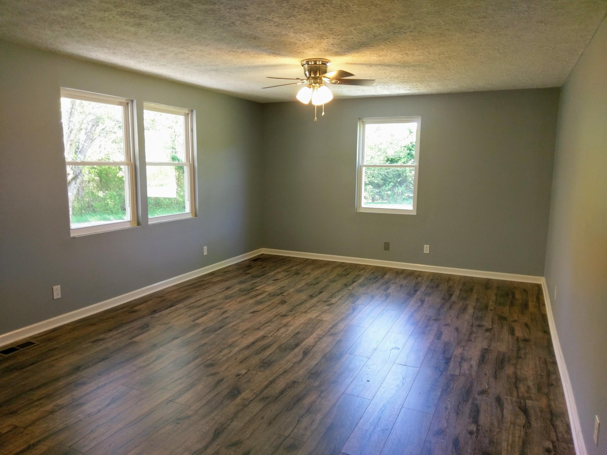 304 Cade Road Ten Mile, TN 37880 - Photo 3 of 19 a view of an empty room with wooden floor and a window