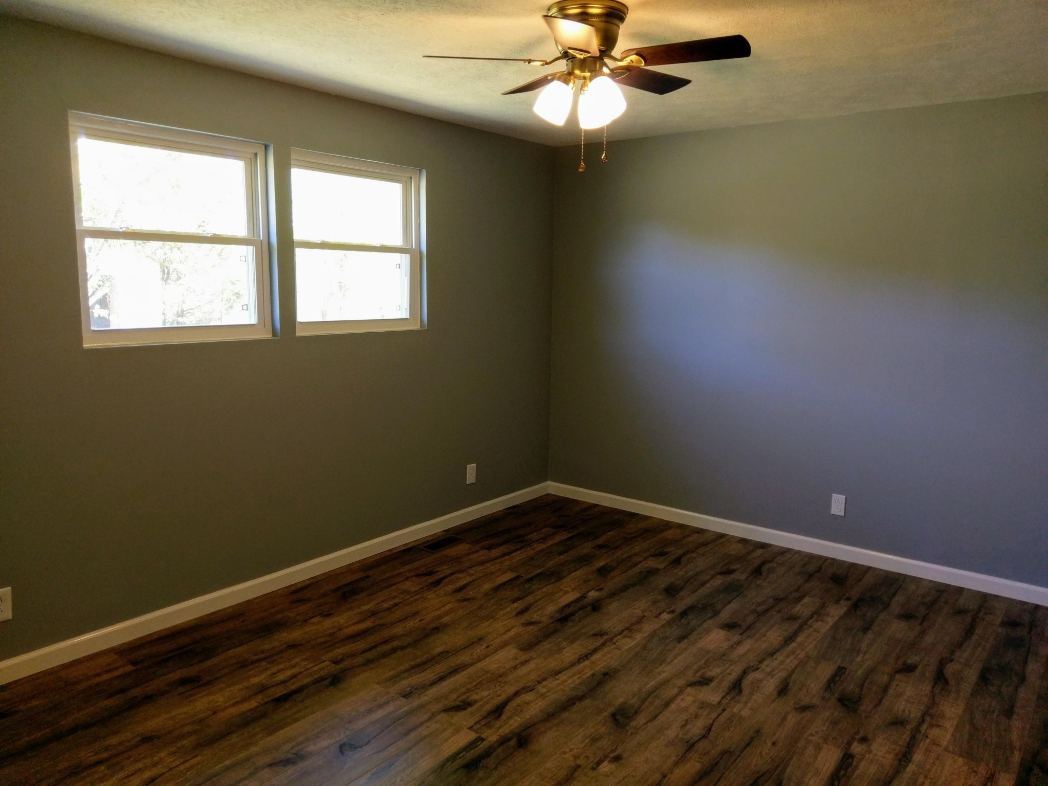 304 Cade Road Ten Mile, TN 37880 - Photo 8 of 19 a view of an empty room with wooden floor and a window