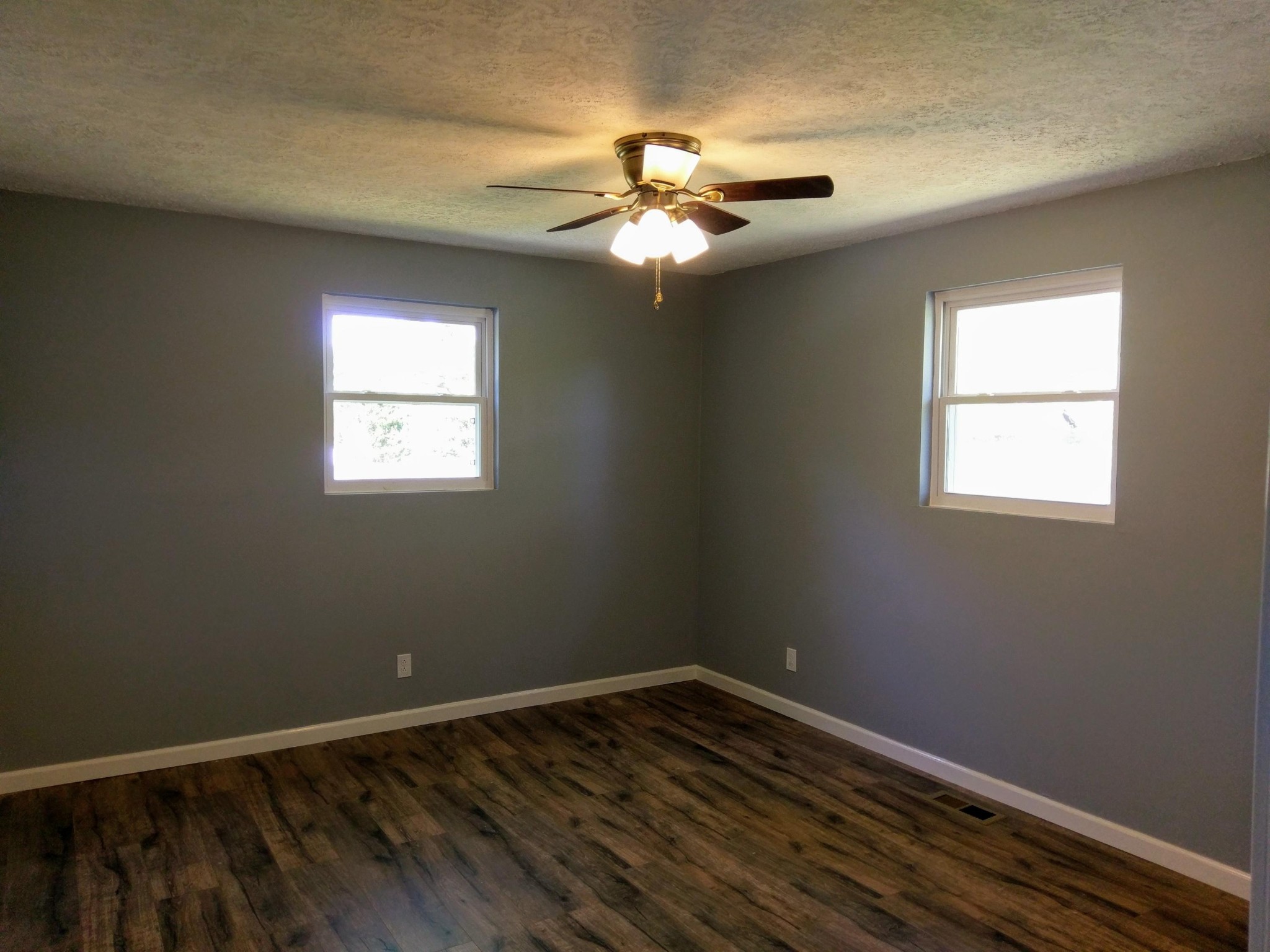 304 Cade Road Ten Mile, TN 37880 - Photo 9 of 19 a view of an empty room with wooden floor and a window