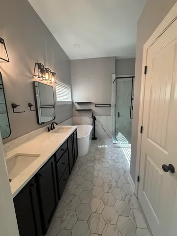 a kitchen with a sink refrigerator and cabinets