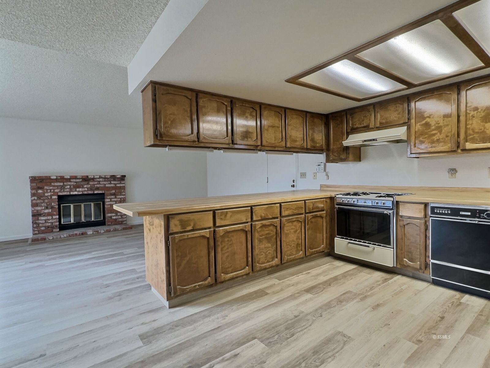 608 South Silver Ridge Street Ridgecrest, CA 93555 - Photo 7 of 30 a kitchen with stainless steel appliances granite countertop a stove and a sink