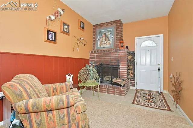 a bedroom with a bed and a chair