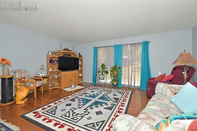 a living room with furniture and a rug