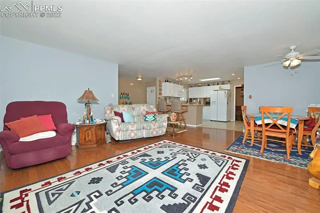 a bedroom with furniture and a wooden floor