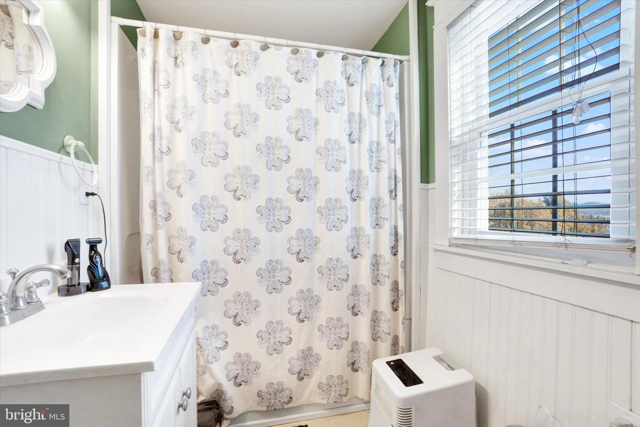 370 East Market Street York, PA 17406 - Photo 16 of 27 a bathroom with a sink and a mirror